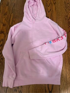 Light Pink Pullover Hoodie with Drawstring and Sleeve Detail ability volleyball